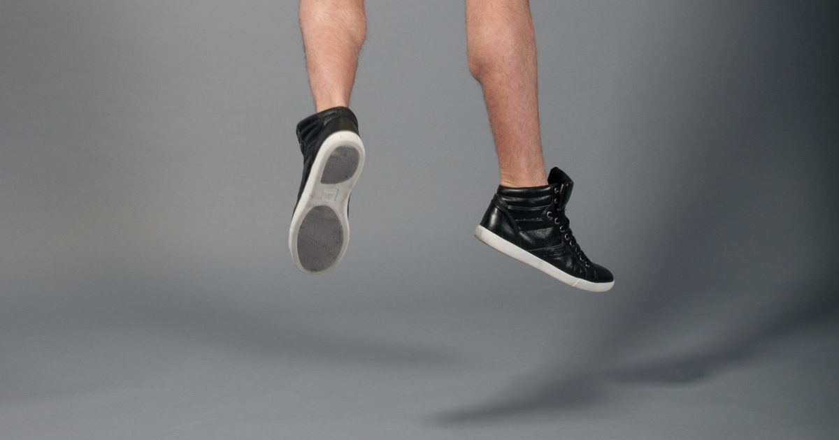 stokpic Mens shoes Jumping Grey Background