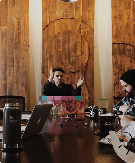 built mighty team at conference table discussing new ideas for woocommerce website development