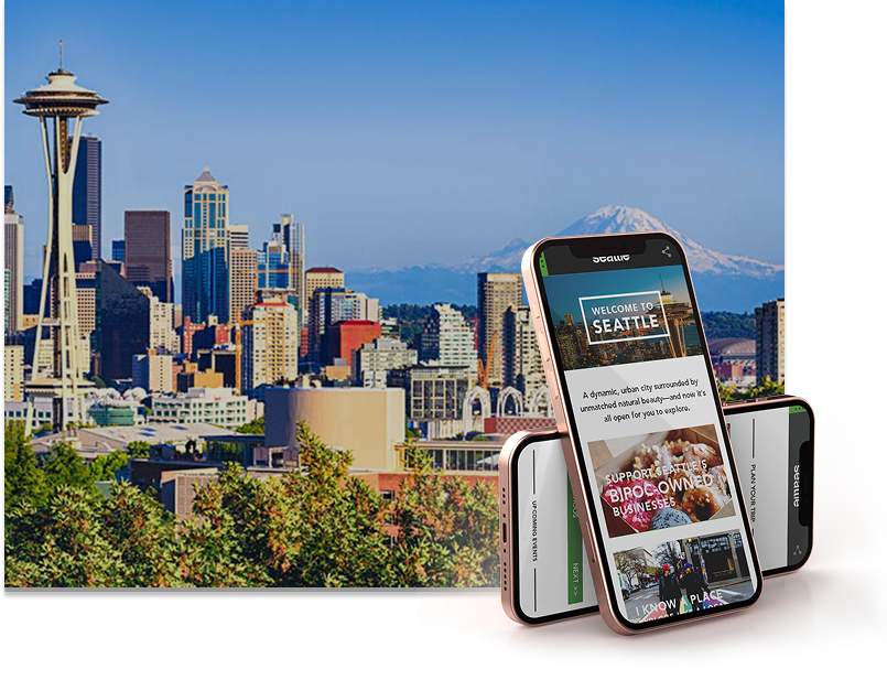 photo of seattle skyline with two iphones showing the visit seattle website 