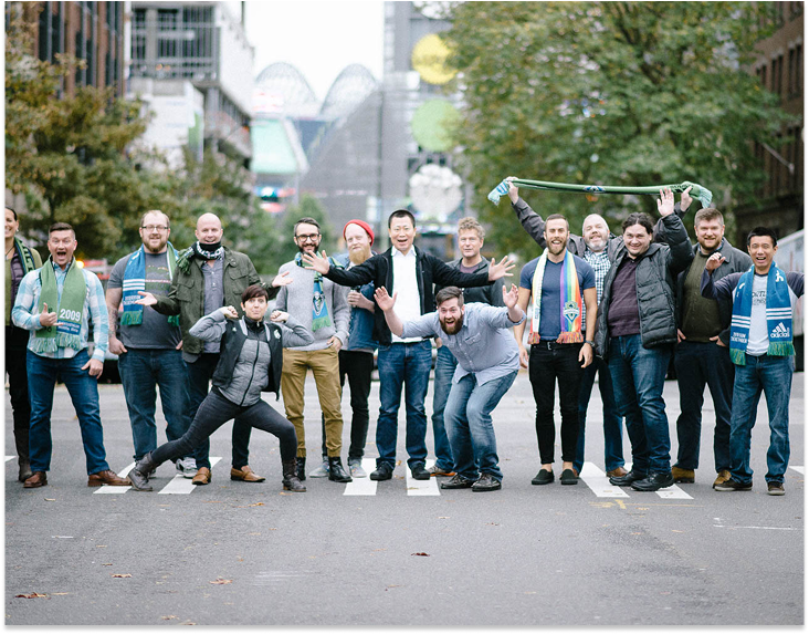 built mighty team acting silly on a street crosswalk in Seattle 
