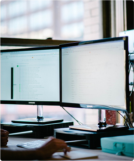 image of two monitor screens for laravel development 